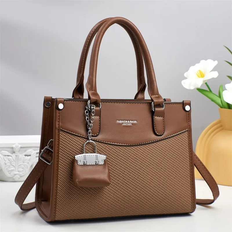 シンプルでクラシックな女性用クロスボディショルダーメッセンジャーバッグ、ファッショナブルなヴィンテージレザーおむつバッグ、ミニマリストデザイナートート、エレガント