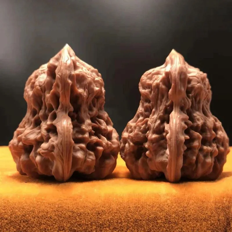 Handcrafted uniquely shaped and carefully selected pieces of Wenshan hemp walnuts paired with hand-held ornaments featuring