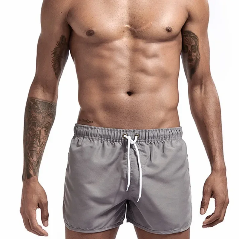 Shorts esportivos de surf na praia masculino, calça casual fitness, tamanho grande, três quartos, verão, 2024