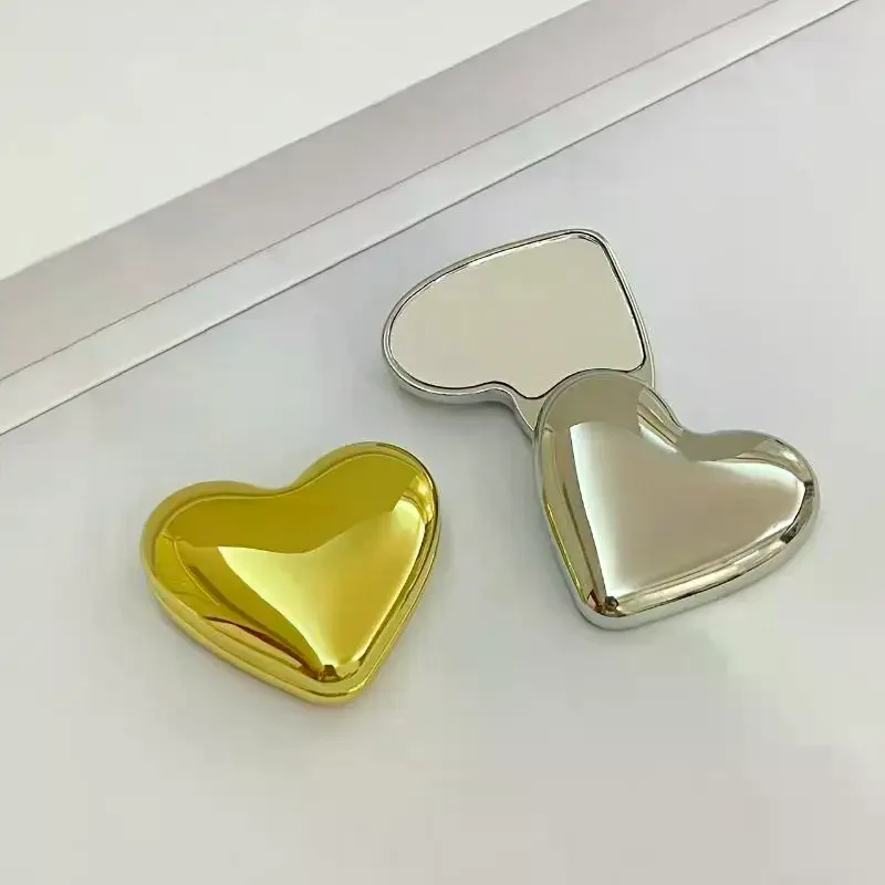 Simpatico specchio per trucco portatile a forma di cuore a doppia faccia rotante per studenti, strumento di bellezza cosmetica, piccolo specchio portatile per ragazze