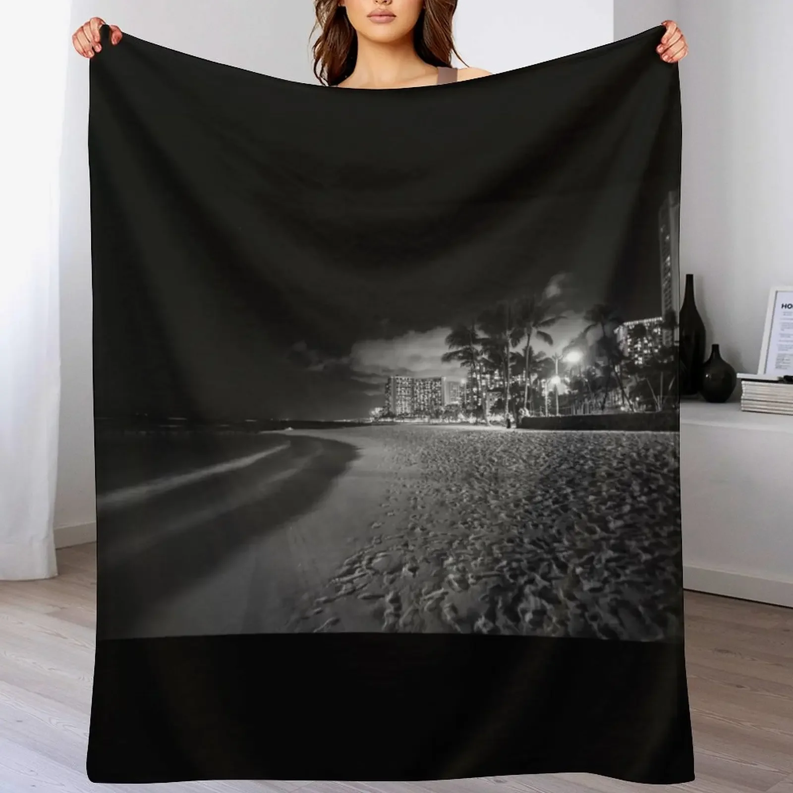 

New Beach palm trees and buildings of Waikiki from beach on tropical island night Throw Blanket Hairys Luxury Blankets