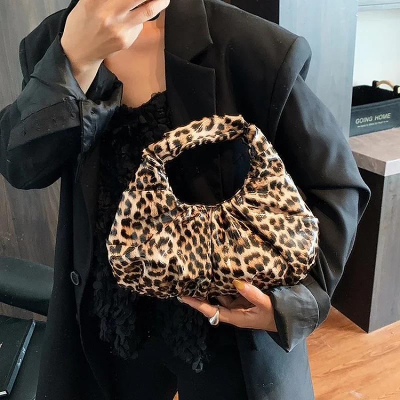 

Chic Handbags For Women In Genuine Leather, By Luxury Brand With Decorative Elements, Timeless And Versatile Accessory
