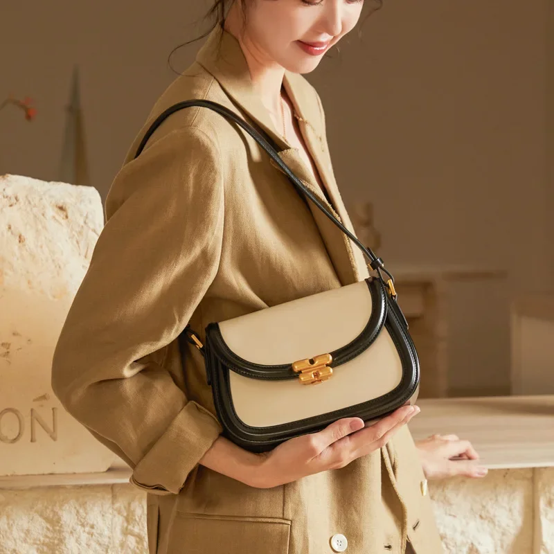 

Contrasting color saddle bag women's crossbody high sense niche leather women's bag 2024 new exquisite lock single shoulder