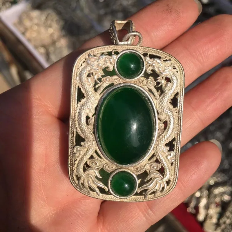 

Tibetan cultural ornament inlaid with imitation emerald, Tibetan silver pendant, Miao silver double dragon pillar necklace