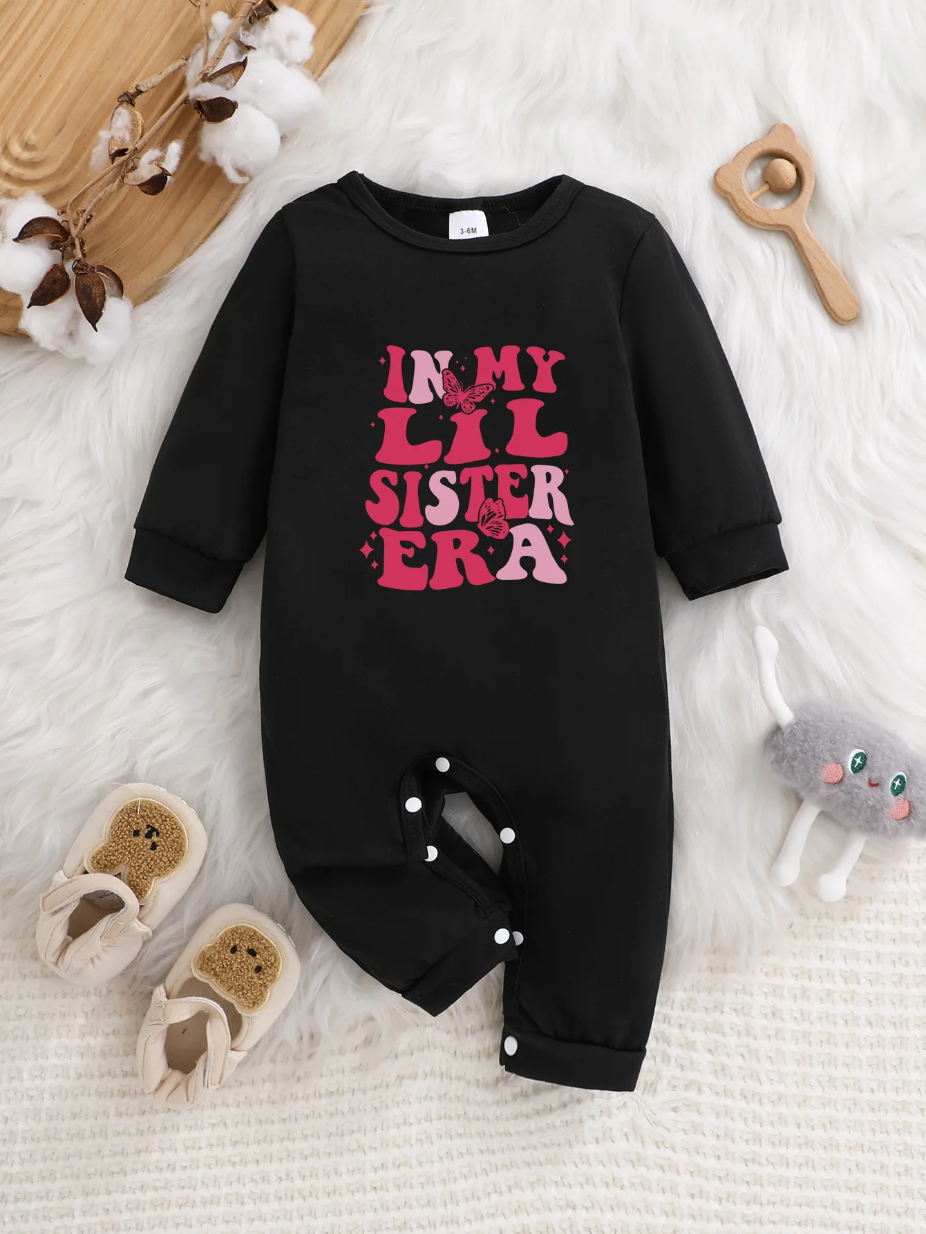 

Baby long-sleeved bodysuit with fun letter prints, button design, easy care, suitable for new parents.