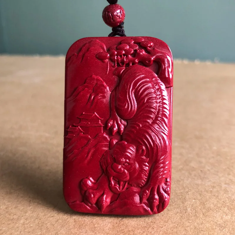 Zijin cinnabar tiger pendant  mountain gives birth to power. Male and female side cards are the patron saint of tiger pendant.