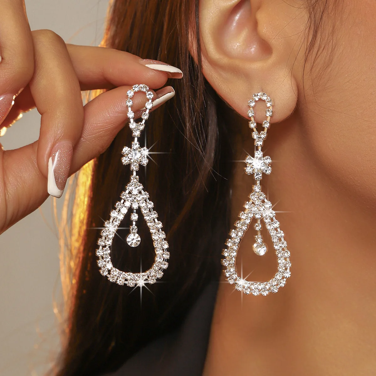 Imported rhinestone earrings, all-copper geometric hollow water drop earrings, women's stud earrings.