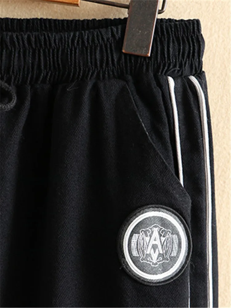 Pantaloni taglie forti in primavera e autunno indossare elastico in vita strisce bianche su entrambi i lati pantaloni larghi pantaloni larghi a gamba larga 3XL-5XL