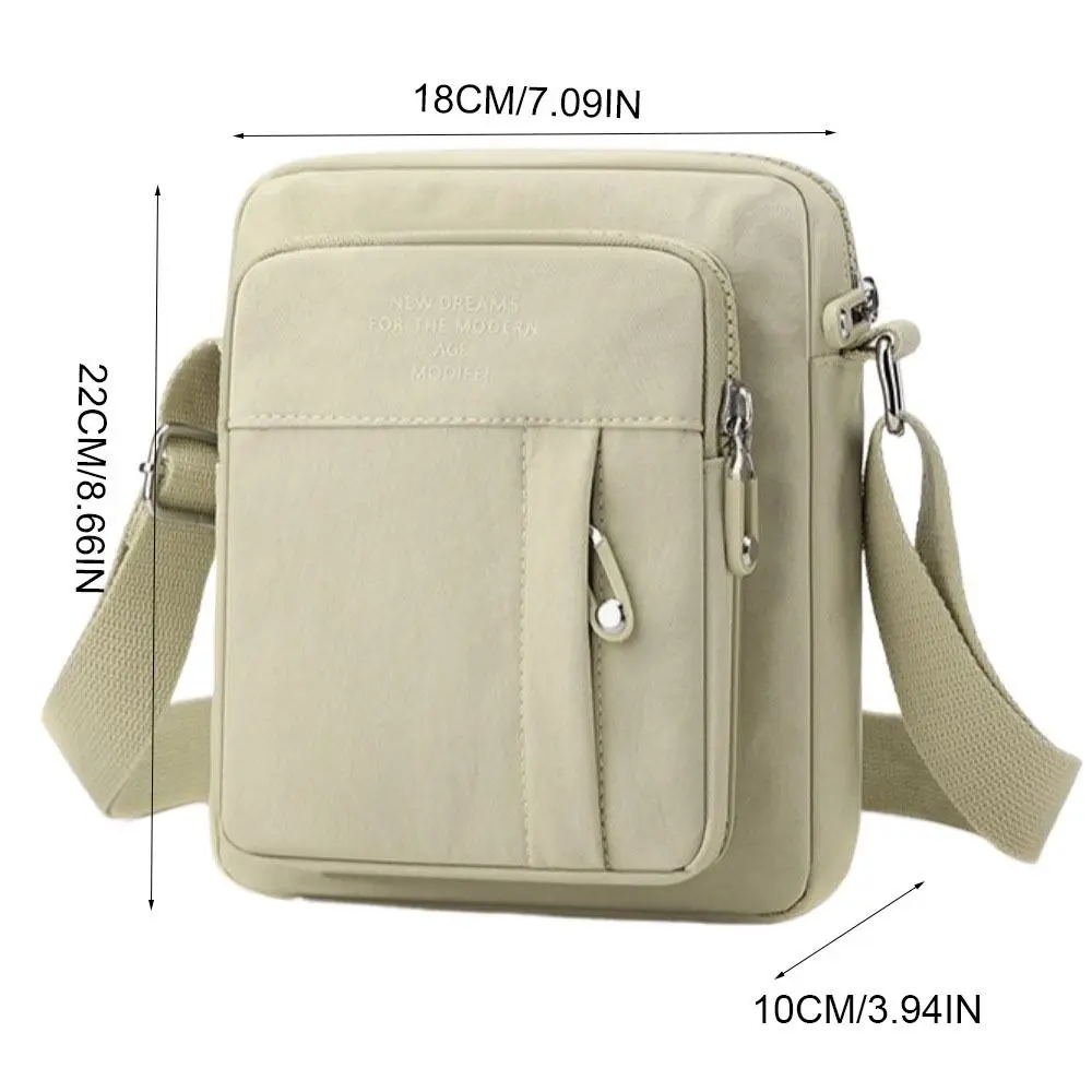 حقيبة كتف كاجوال من النايلون بلون سادة متعددة الطبقات خفيفة الوزن في منتصف العمر على الطراز الكوري حقيبة كروس متعددة الجيوب يوميًا