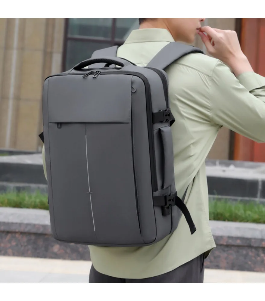 Black expandable travel backpack multi compartment design adjustable compression straps vertical center line detail water