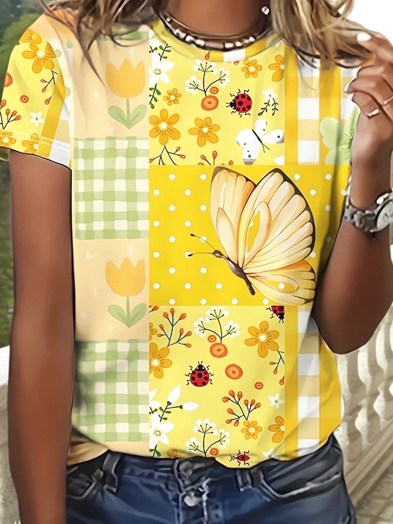 CHEERFUL YELLOW PATCHWORK PRINT WITH BUTTERFLIES, LADYBUGS & FLORALS—BRIGHT, PLAYFUL STYLE. PAIR WITH JEANS FOR A SUNNY, EYE-CAT
