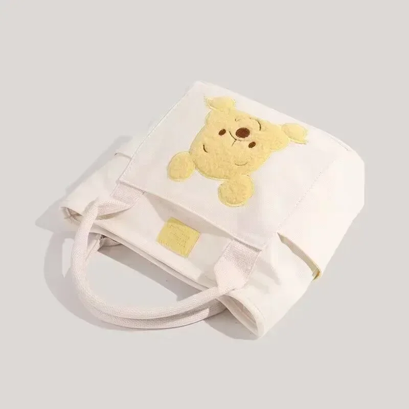 2024 New Disney Cute Cartoon Winnie the Pooh Canvas Crossbody Bag Doll Portable Handheld Crossbody Two-Purpose Bag