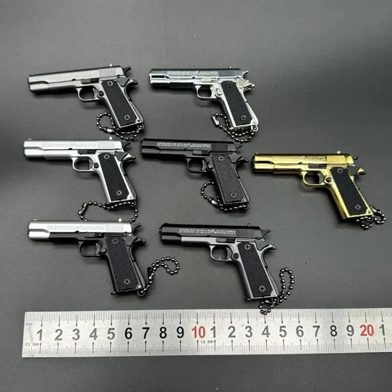 1:3 โลหะทอง M1911 Colt ของเล่นโลหะผสมปืนประดิษฐ์ MINI พวงกุญแจดูจริงคอลเลกชัน PROP วันเกิดแขวนของขวัญ