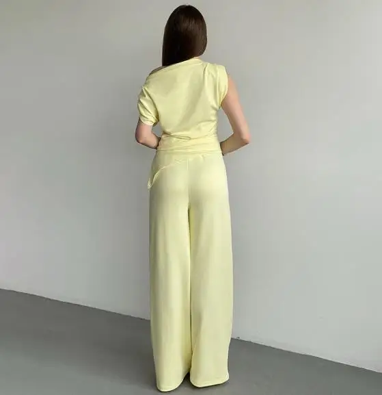 Комплект из двух предметов, женский наряд, весна 2024, новый однотонный комплект без рукавов с наклонным воротником и неровным подолом, топ и карман, прямые брюки