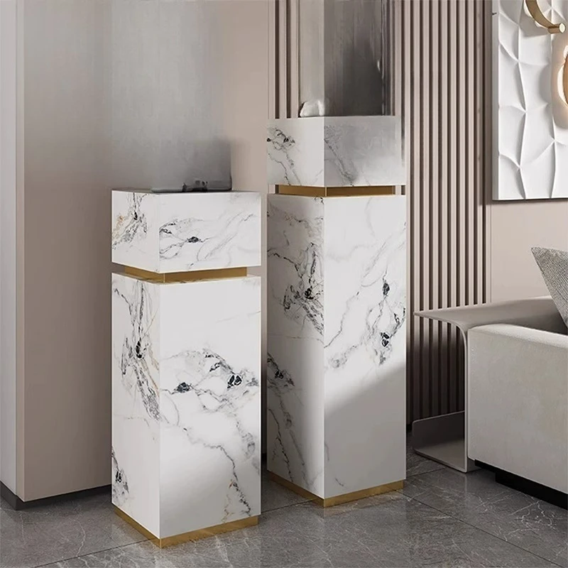 Italian light luxury rock slab floor-to-ceiling flower stand next to stone TV cabinet flower stand
