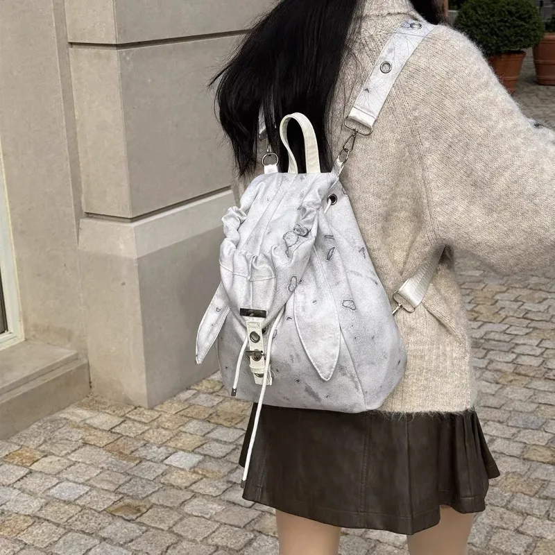

Vintage Cute Rabbit Ear Backpack 2026 Niche Design Drawstring Simple Large Capacity Crossbody Backpack Suitable for DailyOutings