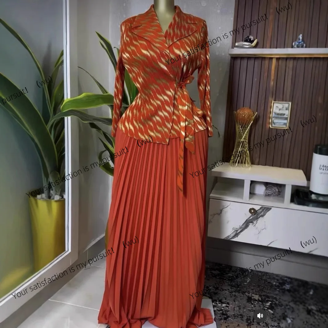 

25 European and American pleated bronzing process printed top + 360 pendulum skirt set