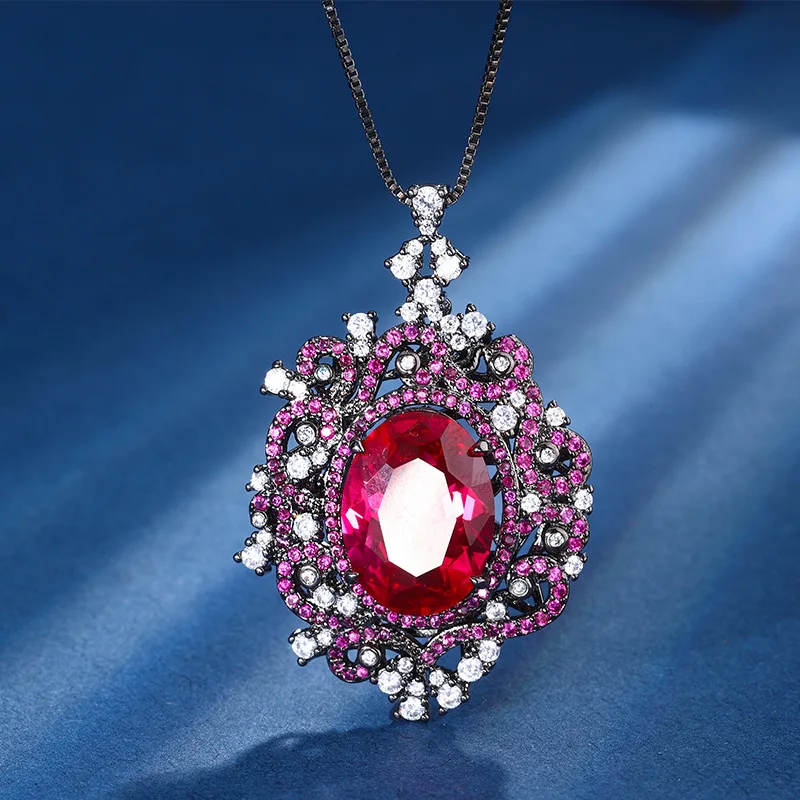 

New European and American vintage jewelry, egg-shaped hollow black gold pendant with colored gemstone, main stone 12*16