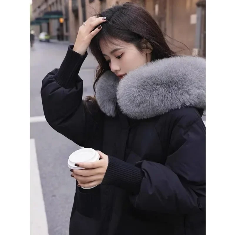 เวอร์ชั่นเกาหลีฤดูหนาวใหม่ขนขนาดใหญ่ลงเสื้อแจ็คเก็ตหญิงความยาวกลางสไตล์แฟชั่นหนาสําหรับความอบอุ่นเสื้ออินเทรนด์