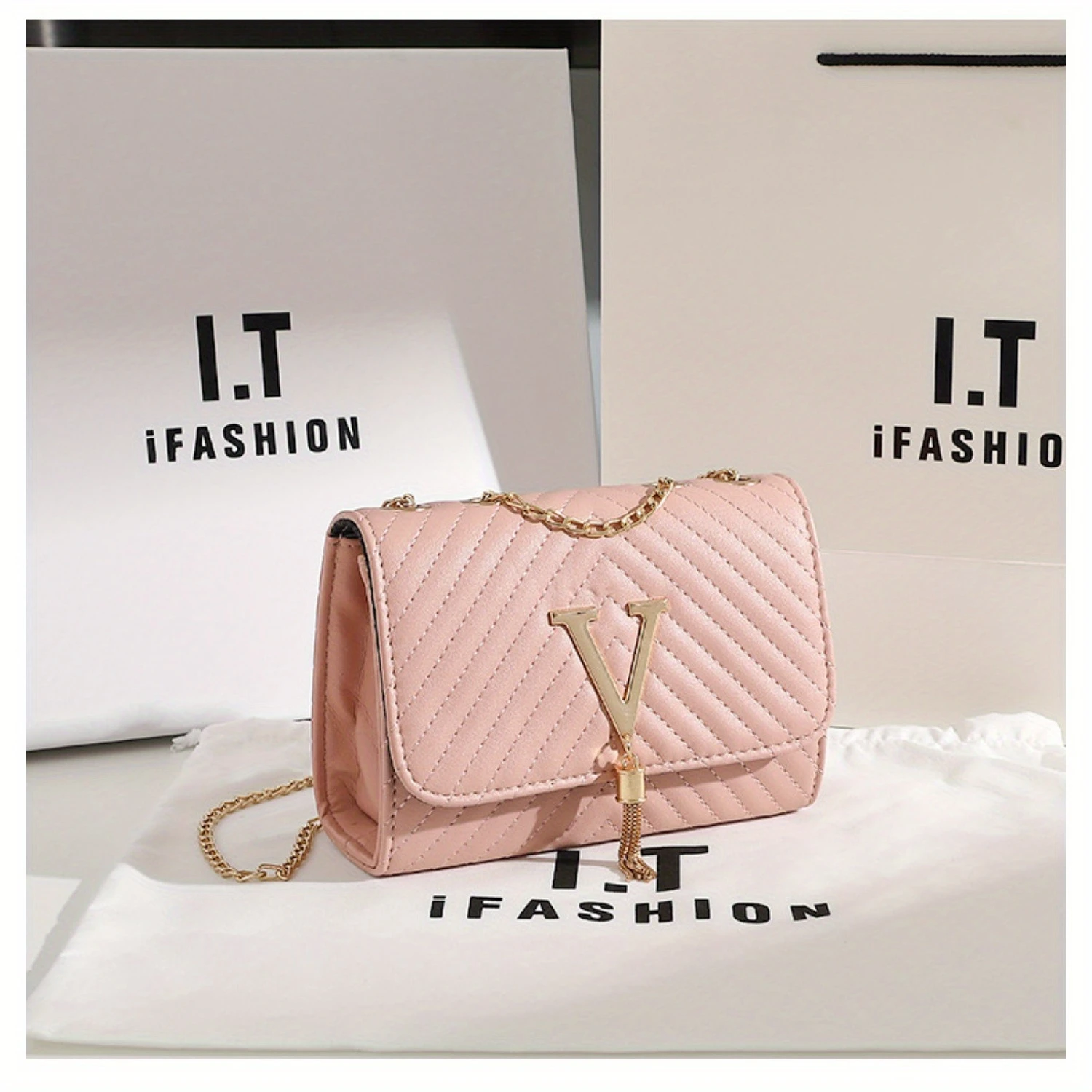 Bolsa crossbody acolchoada de couro PU elegante com borla