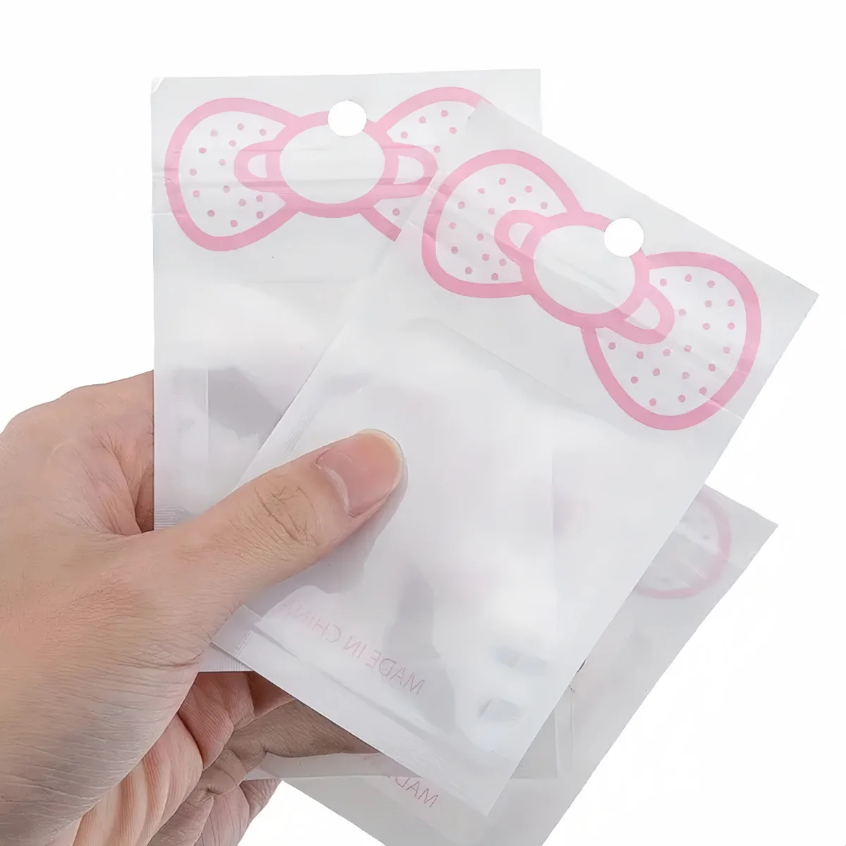 50 Stück/Lot Rosa Transparente Mylar-Ziplock-Beutel mit Schleife Wiederverschließbare Ornament-Aufbewahrungsbeutel für Süßigkeiten, Kekse, Geschenke und Verpackungen – Detail 6