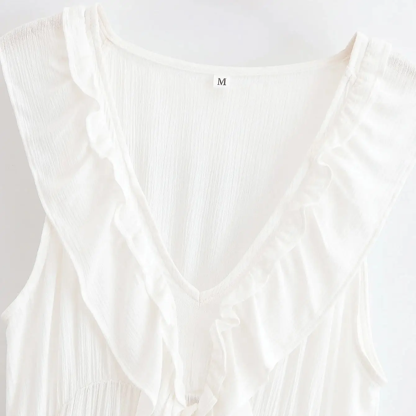 2025 BOHO Estate Bianco Nero Orecchie di legno Ruffles Scollo a V Abito senza maniche Donna Cascata allentata Orlo foderato Abiti corti Summr Robe