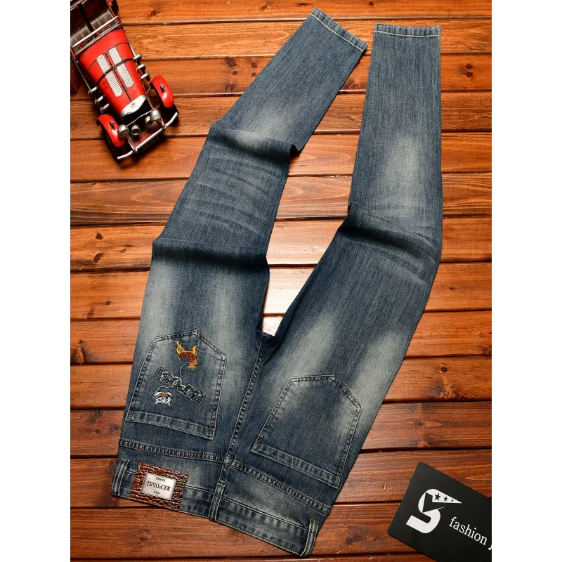 جينز عالي الجودة للرجال صيفي قابل للتمدد من قماش الدنيم بتصميم كلاسيكي عصري ومطرز بطباعة كاجوال بقصة ضيقة وسراويل طويلة للقدم الصغيرة