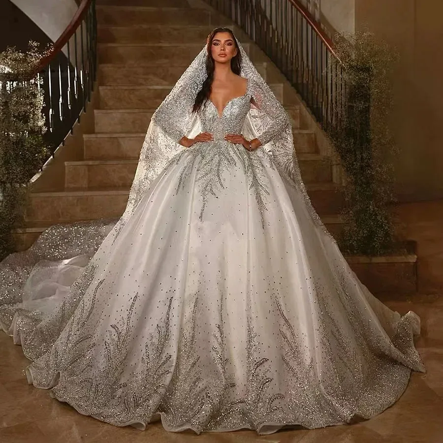 

Customized White Wedding Dress With Gorgeous And Elegant Deep V-Neck Design Long Sleeved Rhinestone Decals Fluffy Large Skirt