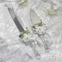 A box of wedding cutlery with rose decoration for cake cutting, bridal season and engagement supplies