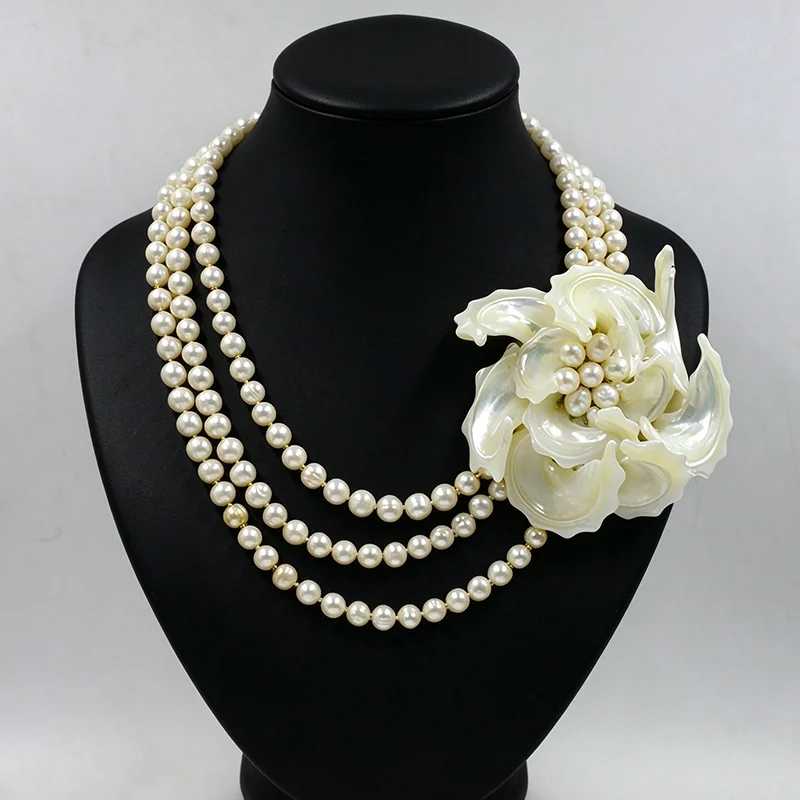 The latest design.3 layers of 8MM grade A natural freshwater pearls.Shell flower necklace.Bride's wedding Jewelry