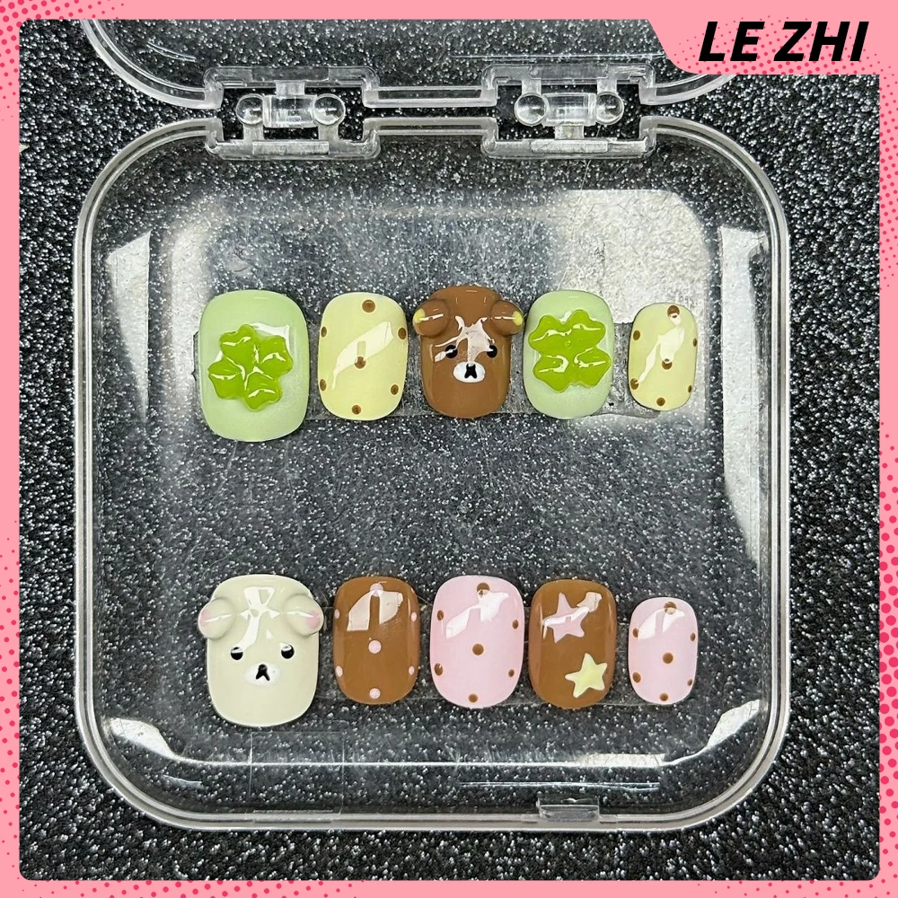 Dulce fresco hecho a mano elipse corta prensa en uñas dibujos animados Rilakkuma estrella brillante diamante Bowknot alas notas musicales uñas postizas