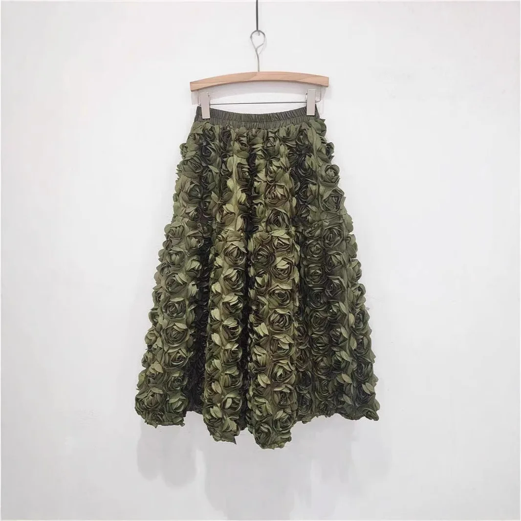 Saia de meio corpo com cintura elástica de flor estéreo elegante de cor sólida. Senhoras primavera e verão novas saias casuais rosa de comprimento médio