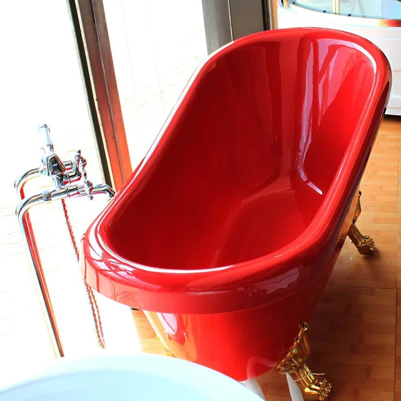 red bathtub with four legs claw foot tub