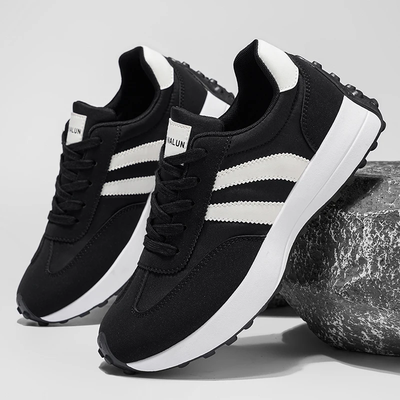 A pair of men's spring casual sports shoes. Striped design on the upper. Thickened, wear-resistant and highly scratch-resistant