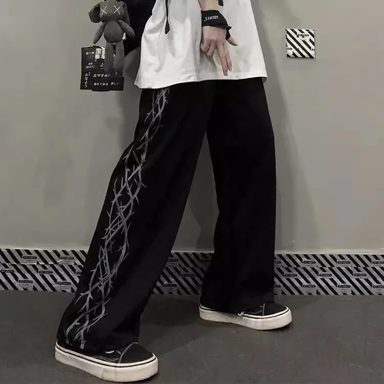 Versione coreana della tendenza di high street retro thorn print Harajuku pantaloni larghi a gamba dritta larghi pantaloni casual