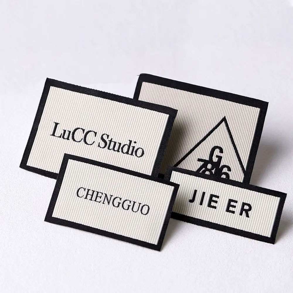 

Custom High Quality Clothing Woven Labels with Textured Fabric Personalized Logo Tags for Clothing Bags And Shoes - High Density
