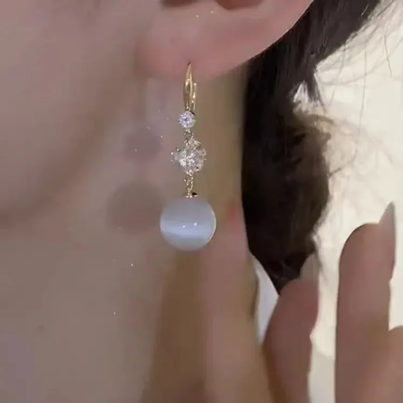 أقراط طويلة على شكل كرة أوبال 2026 أقراط عصرية جديدة على الطراز الأجنبي أقراط كلاسيكية فاخرة وخفيفة الوزن #3