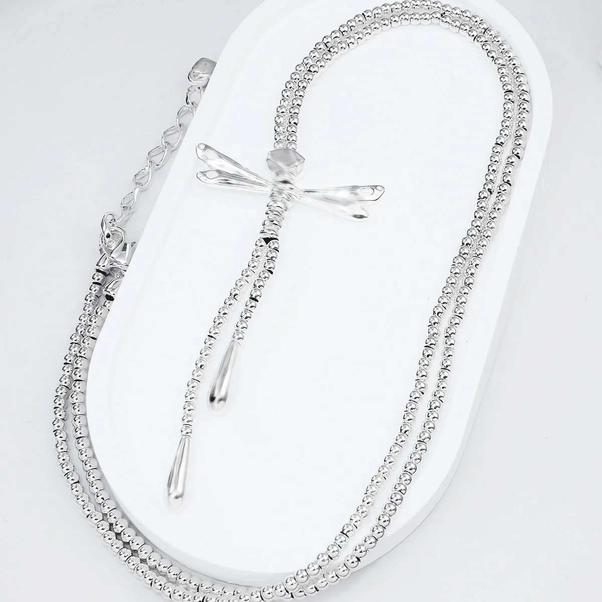 

2025-бестселлер в Испании, новое гальваническое серебряное кулон с кисточкой в виде стрекозы, модное универсальное ожерелье