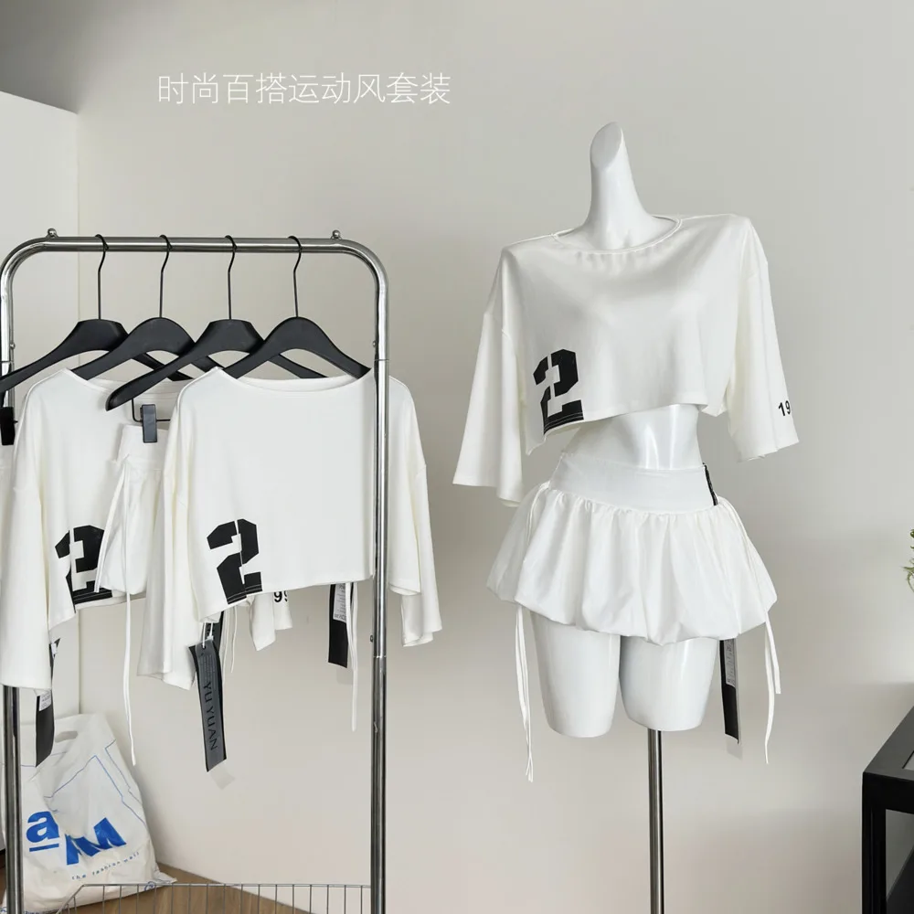 

Комплект Spicy Girl, женская летняя свободная короткая футболка с высокой талией, юбка трапециевидной формы, модная женская одежда из двух предметов, утягивающие юбки-миди