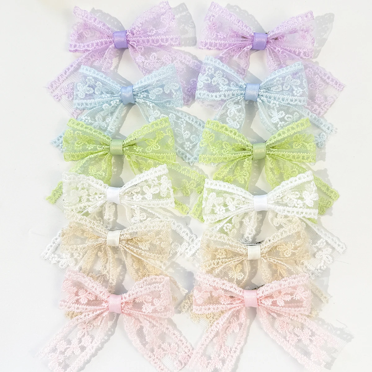 

12 pieces popular floral-themed teenage girl bow hair clips, perfect for girls' sweet outings and photoshoots as accessories.