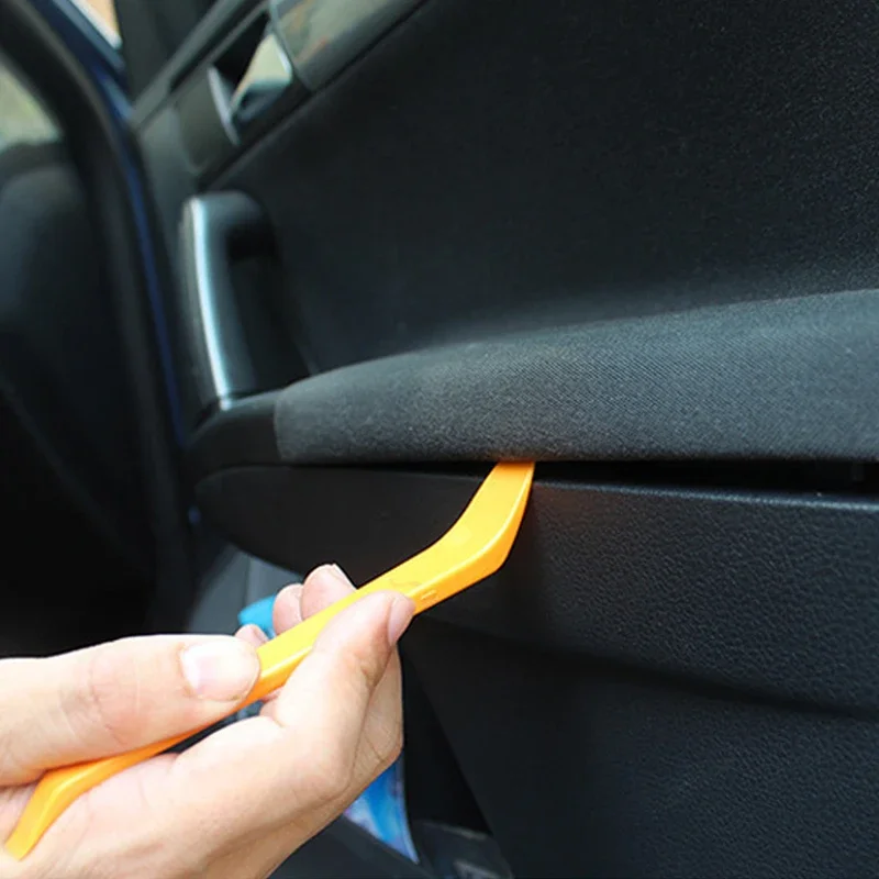 A four-piece disassembly tool set for removing and cleaning car radios, door handles, interior panels, and instrument clusters.
