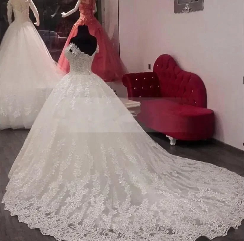 Abiti da sposa a trapezio eleganti con spalle scoperte Dubai personalizzati Abiti da sposa con scollo rotondo trasparente in pizzo con perline Vestios De Novia