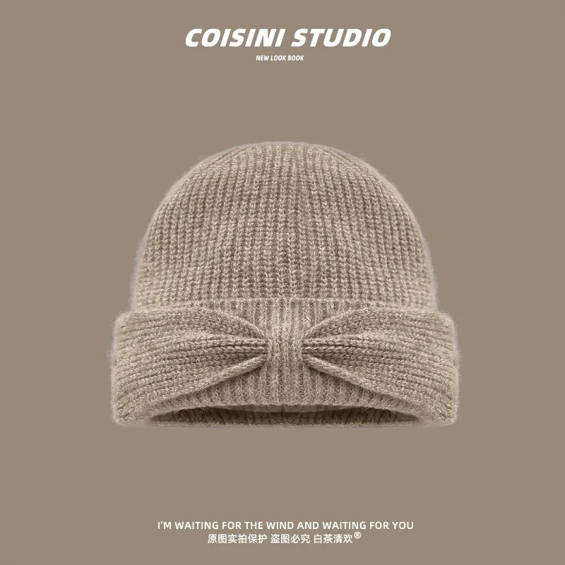 Koreanischer Stil Herbst- und Winter-Strickmütze mit einfacher Schleife für Damen, warme Ohrenschutz-Beanie-Mütze für Herbst und Winter. – Detail 5
