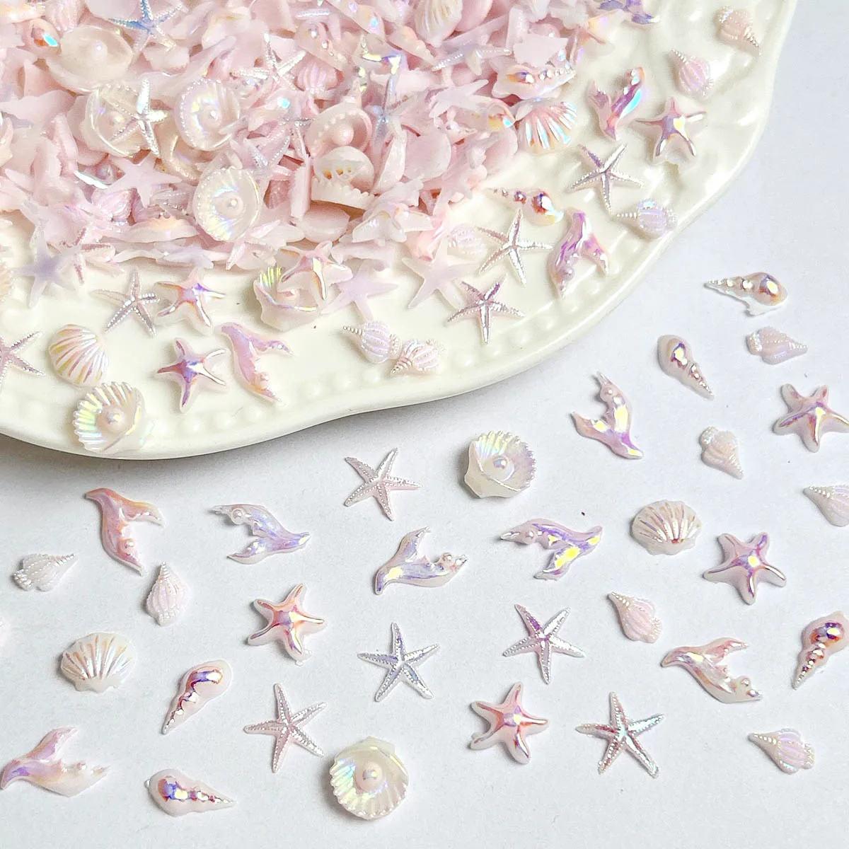 Rosa Schillernde Ozean-Nagelcharms 3D Harz-Muschel Seestern Meerjungfrauenschwanz Nagelkunst-Dekorationen für Sommer-Strand-Maniküre, DIY-Basteleien