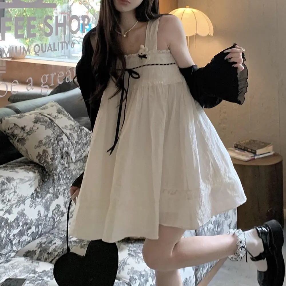 

Japan College-Style Sweet Fresh And Age-Reducing Black Sunscreen Cardigan Paired With A Niche Suspender Skirt Two-Piece Set