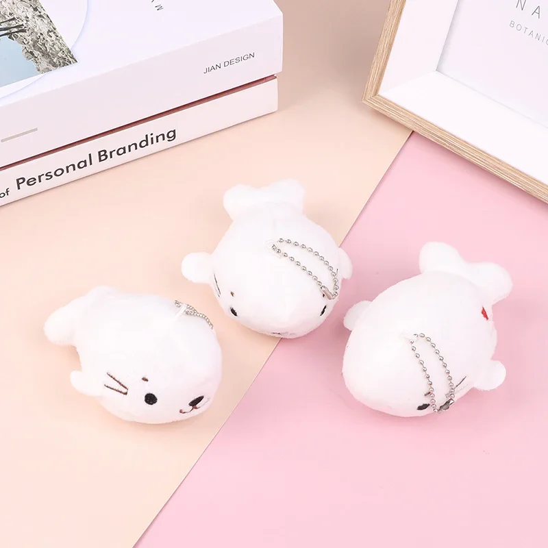 

Лидер продаж 2023, 10 см, маленькая милая белая плюшевая игрушка с печатью, мультяшный белый морской лев, качественный брелок для ключей, кукла, детский фотоподарок