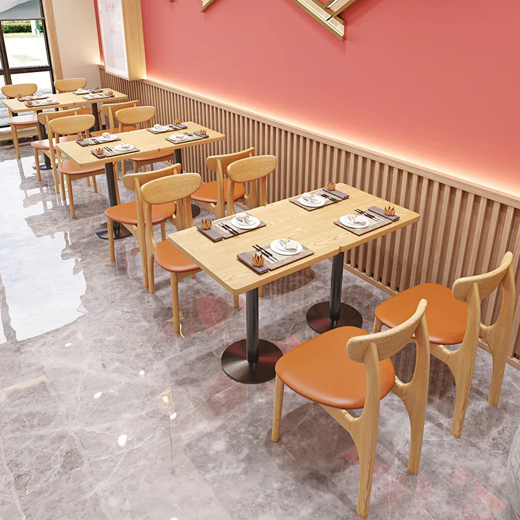 Combination of Solid Wood Orange Chairs Tables and Chairs Against the Wall in Restaurants and Fast Food Restaurants