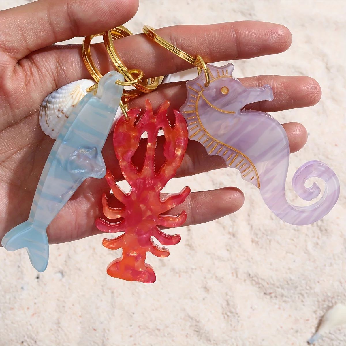 Colección de Acrílico de Criaturas Marinas que Incluye un Estrella de Mar, un Caballito de Mar, un Tiburón, un Delfín y un Langosta, Diseñada como un Llavero