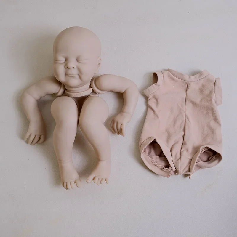 Zestaw dla lalek Reborn NPK 19'' Olivia, niezamalowana, świeży kolor, z tkaninowym ciałem i oczami, wysokiej jakości części do samodzielnego wykonania lalek.