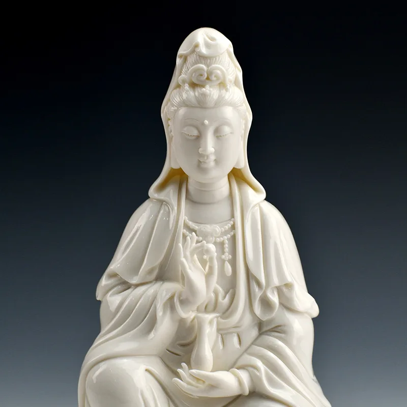 

Buddha statue of Guanyin Bodhisattva is dedicated to the white porcelain Avalokitesvara statue of sitting lotus Buddha ornaments